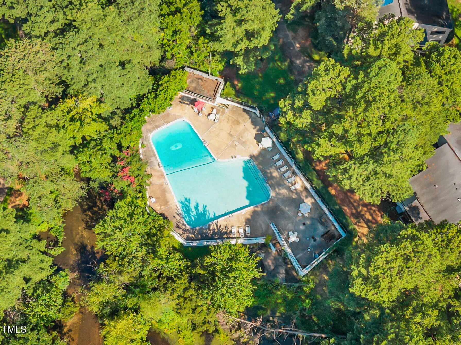 5024 Flint Ridge Place Raleigh, NC 27609 - Photo 41 of 46 an aerial view of a house with a yard and swimming pool