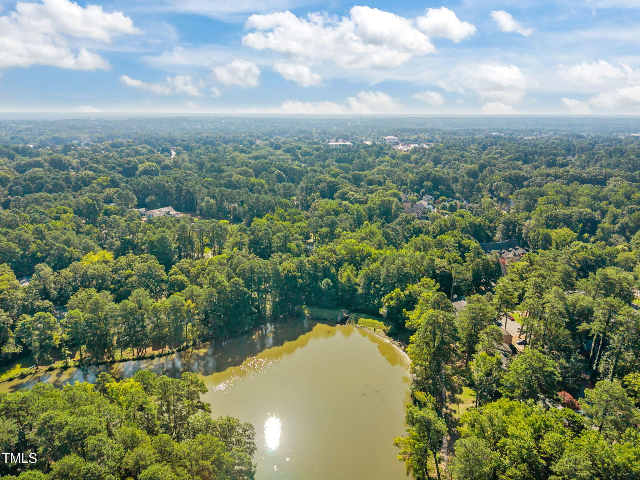 5024 Flint Ridge Place Raleigh, NC 27609 - Photo 45 of 46 a view of a lake with top of house