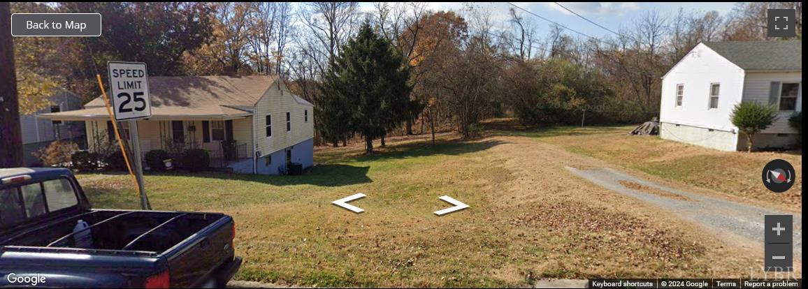 1147 Stratford Road Lynchburg, VA 24502 - Photo 9 of 12 a view of a white house with a yard