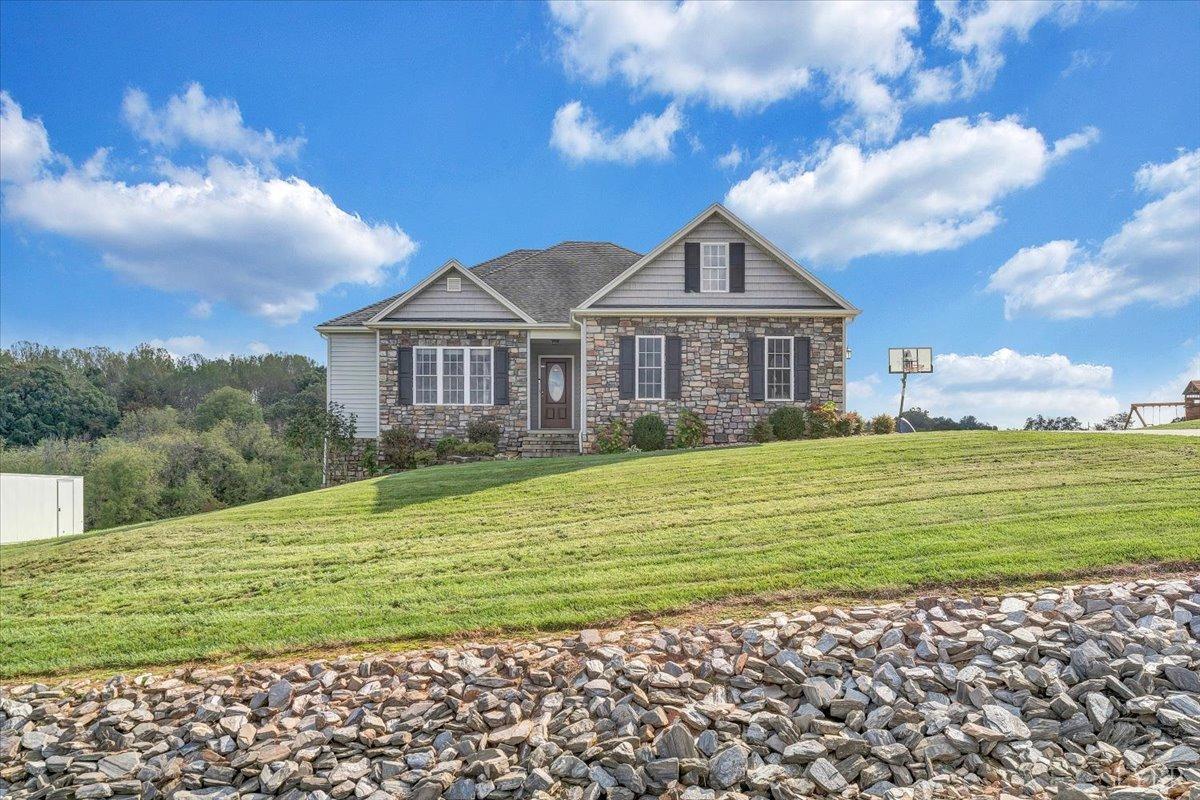 1251 Battlefield Road Goode, VA 24556 - Photo 54 of 58 a house with green field in front of it