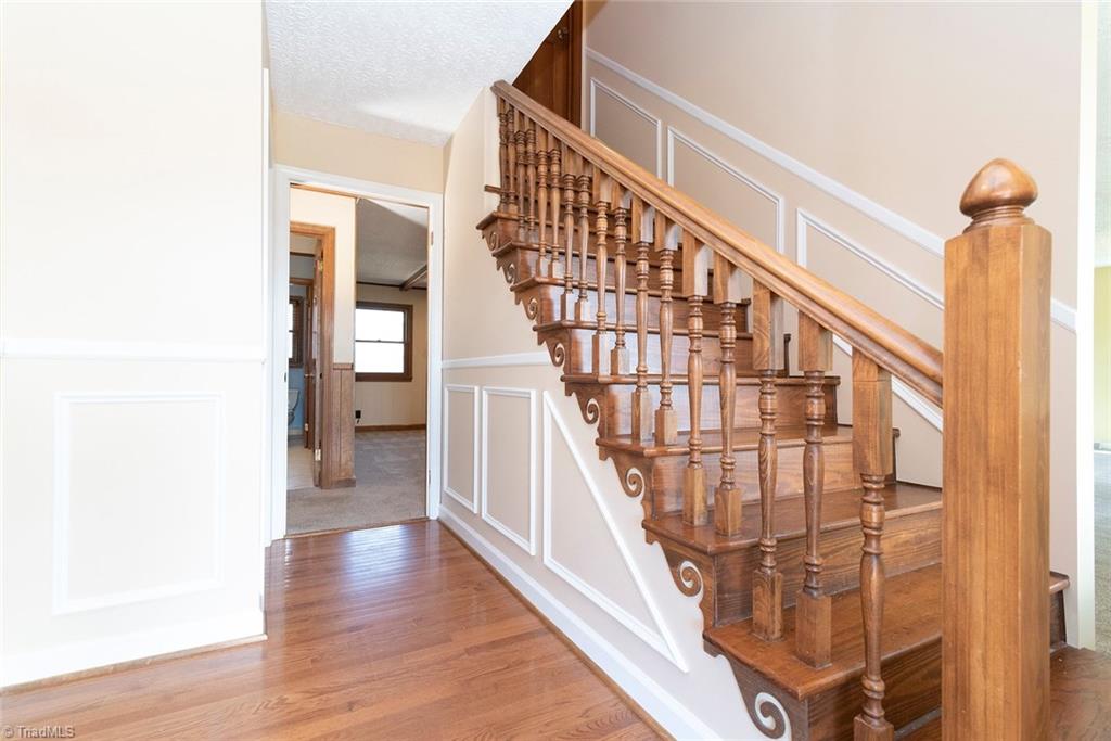 8151 Center Grove Church Road Clemmons, NC 27012 - Photo 6 of 30 Foyer with stairs leading to incredible unfinished space that offers many possibilities.