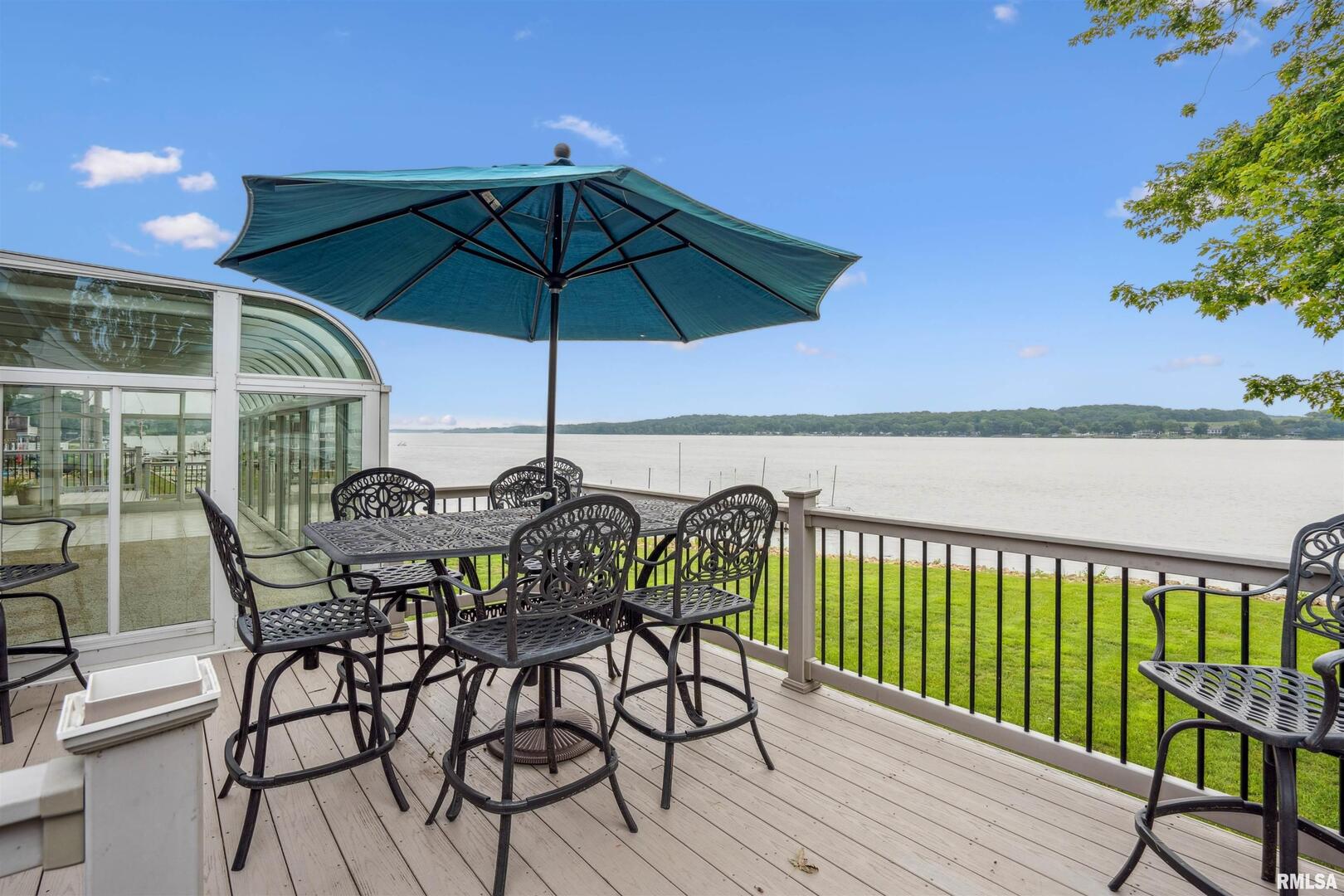 22799 Great River Road Le Claire, IA 52753 - Photo 8 of 48 a view of chair and table in the balcony