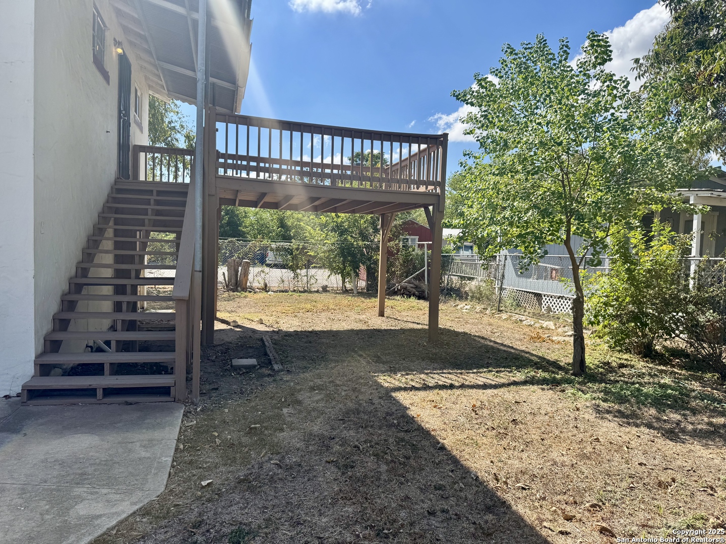 108 Robert E Lee, Unit 2 San Antonio, TX 78214 - Photo 3 of 8 a view of a house with backyard and wooden roof