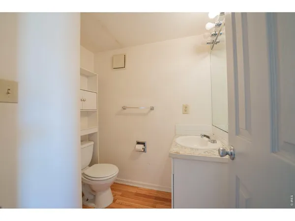 a bathroom with a toilet a sink and shower