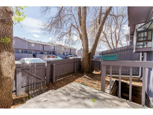 a view of a backyard with sitting area and furniture