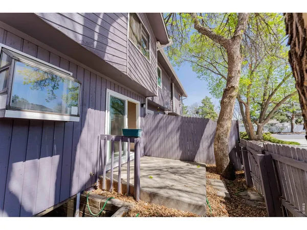 a view of a patio in a backyard