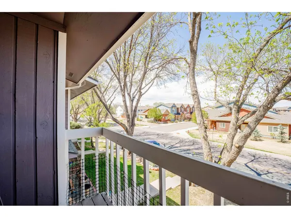 a view of balcony with wooden floor
