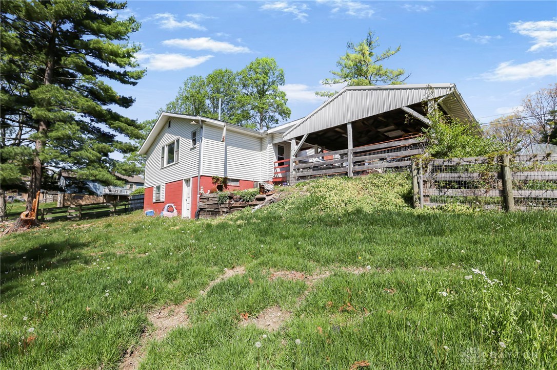 2390 Ridge Road Zanesville, OH 43701 - Photo 32 of 45 This charming home features a classic exterior and lush, expansive yard space.