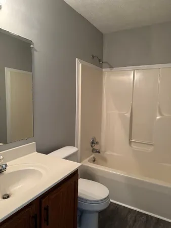 an empty room with closet area
