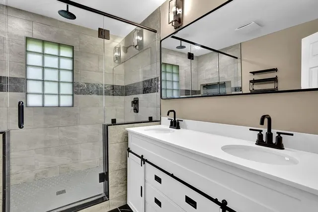 a bathroom with a sink and a mirror