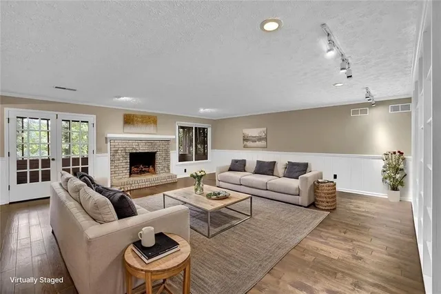 a living room with furniture and a fireplace