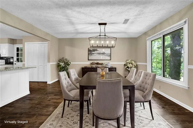 a view of a dining room with furniture window and outside view