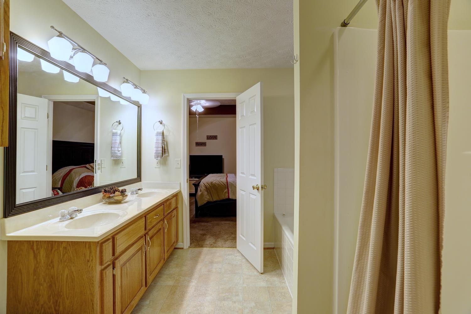 105 Lear Road Portland, TN 37148 - Photo 12 of 25 a en suite bathroom with a sink and a mirror