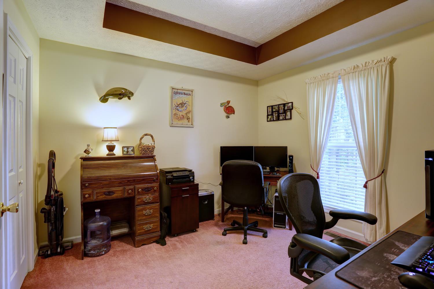 105 Lear Road Portland, TN 37148 - Photo 13 of 25 a view of a workspace with furniture and a window