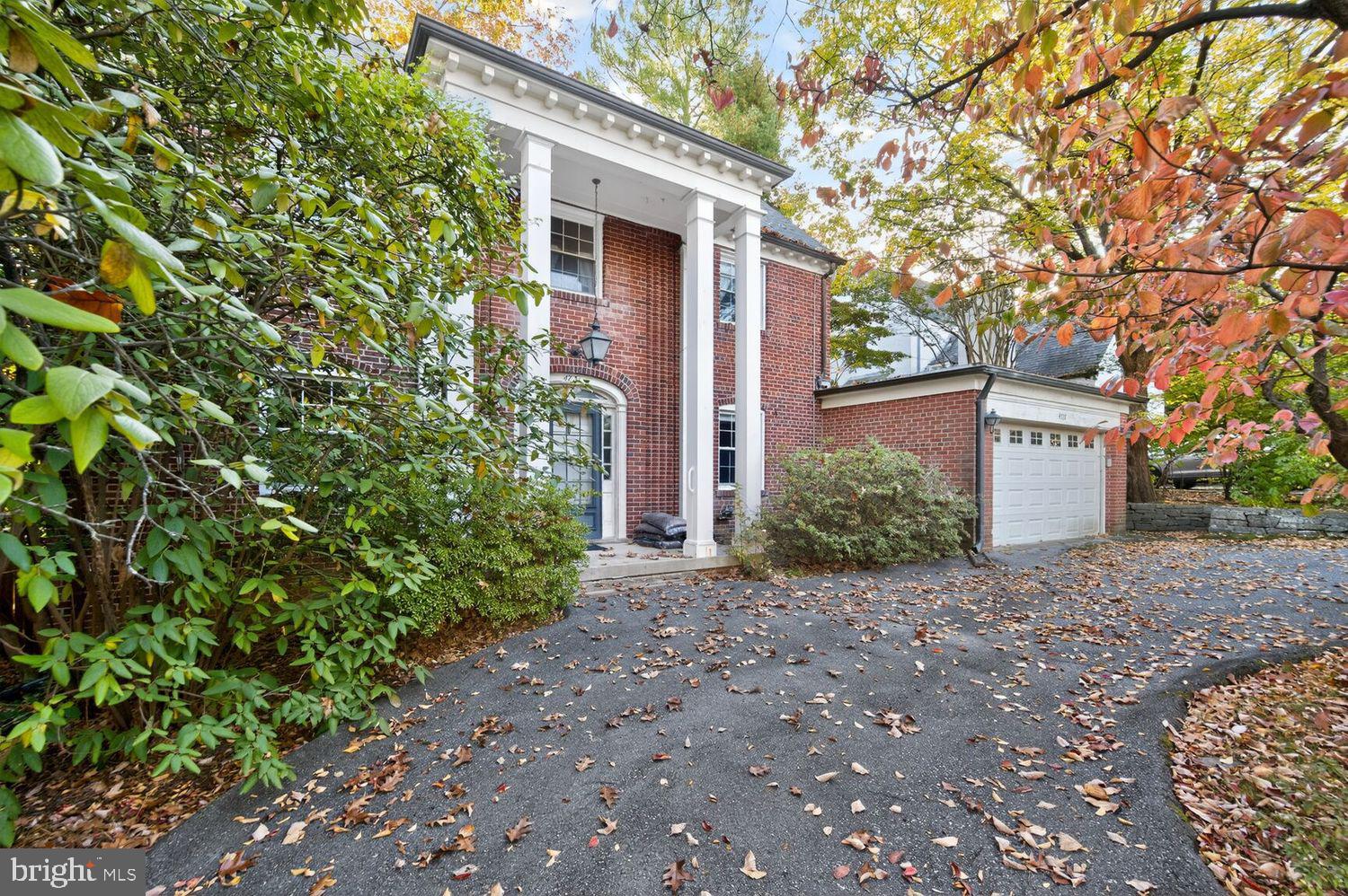 a house with a tree in front of it