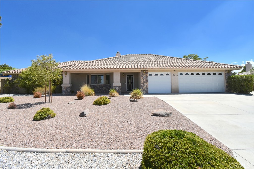13647 Choco Road Apple Valley, CA 92308 - Photo 1 of 1 a view of a house with backyard and sitting area