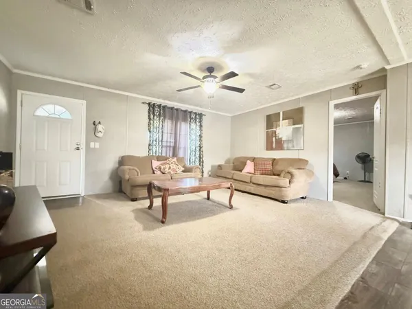 a large kitchen with stainless steel appliances kitchen island granite countertop a sink counter space and cabinets