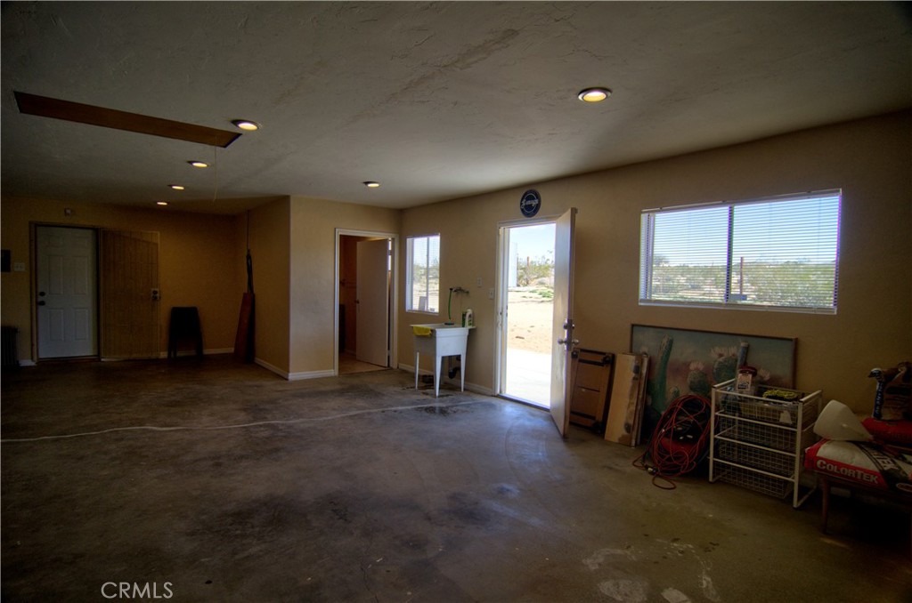 51063 Joshua Tree Road Johnson Valley, CA 92285 - Photo 27 of 35 The backdoor from the garage leads out to the backyard.