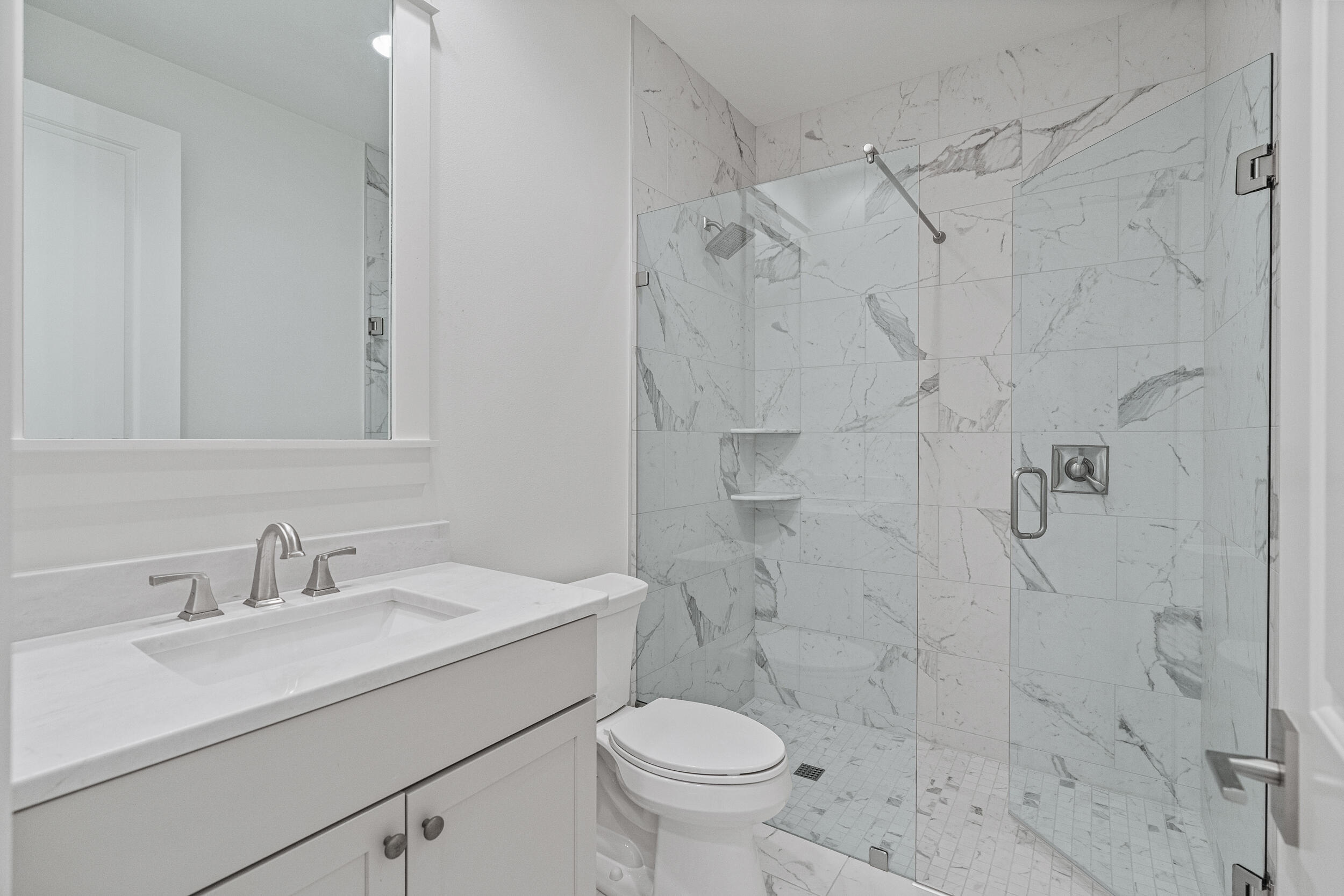 77 Cannonball Lane, Unit LOT (174) Inlet Beach, FL 32461 - Photo 19 of 46 a bathroom with a sink toilet and shower