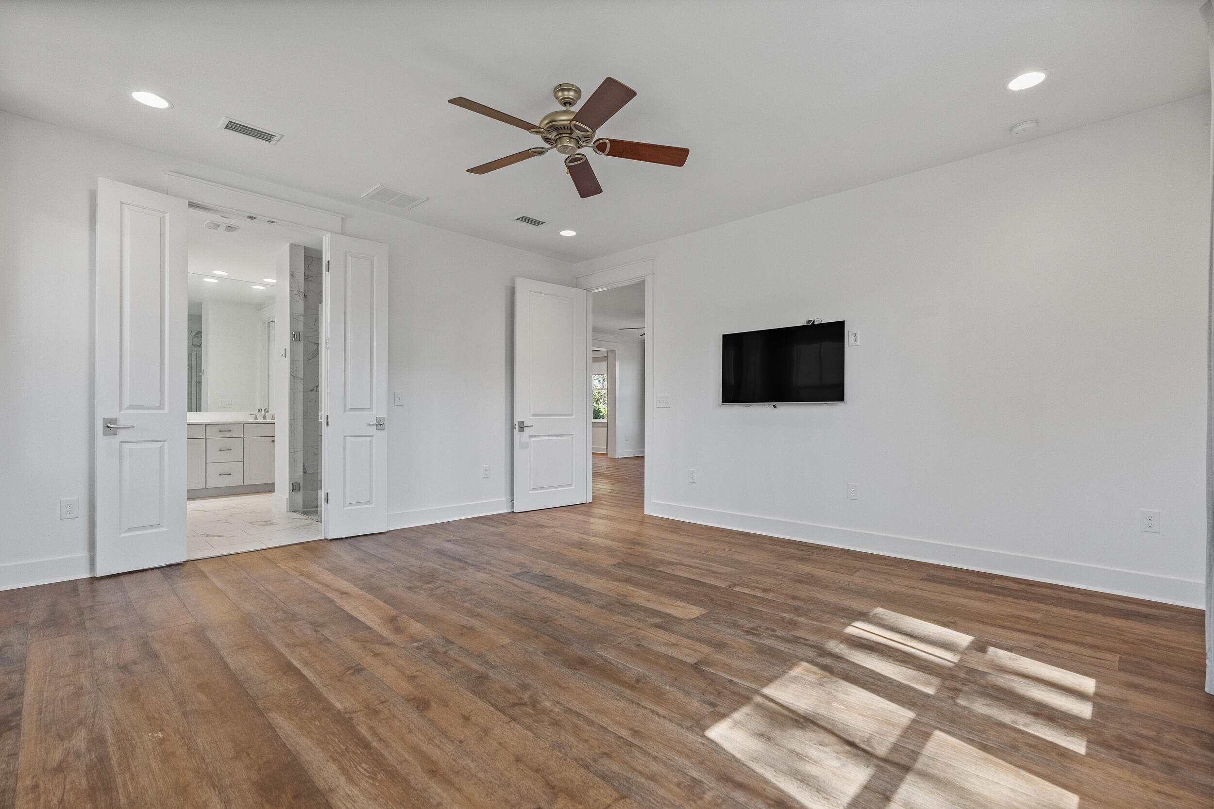 77 Cannonball Lane, Unit LOT (174) Inlet Beach, FL 32461 - Photo 26 of 46 a view of empty room with wooden floor and fan
