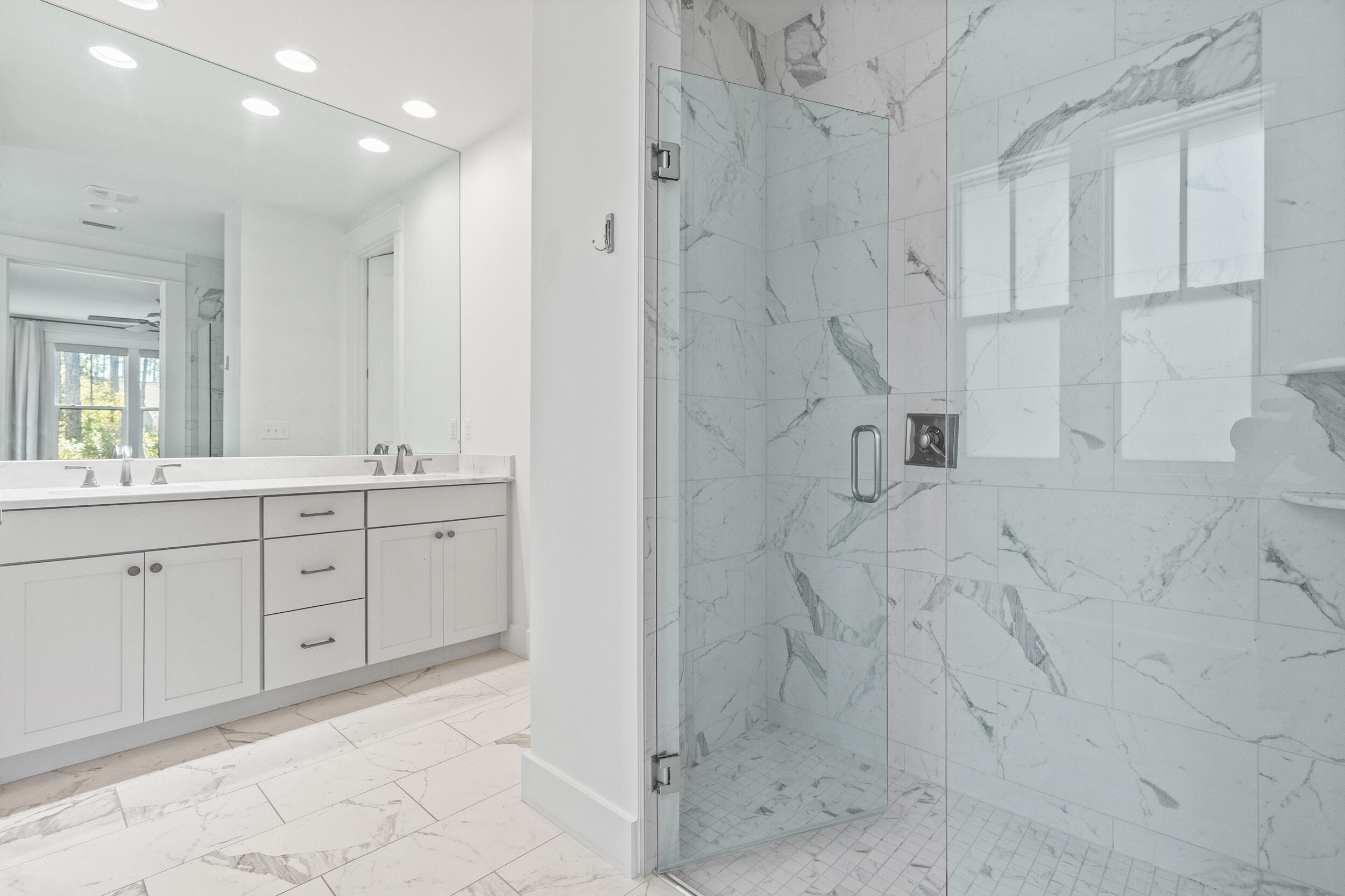 77 Cannonball Lane, Unit LOT (174) Inlet Beach, FL 32461 - Photo 29 of 46 a spacious bathroom with shower sink and mirror