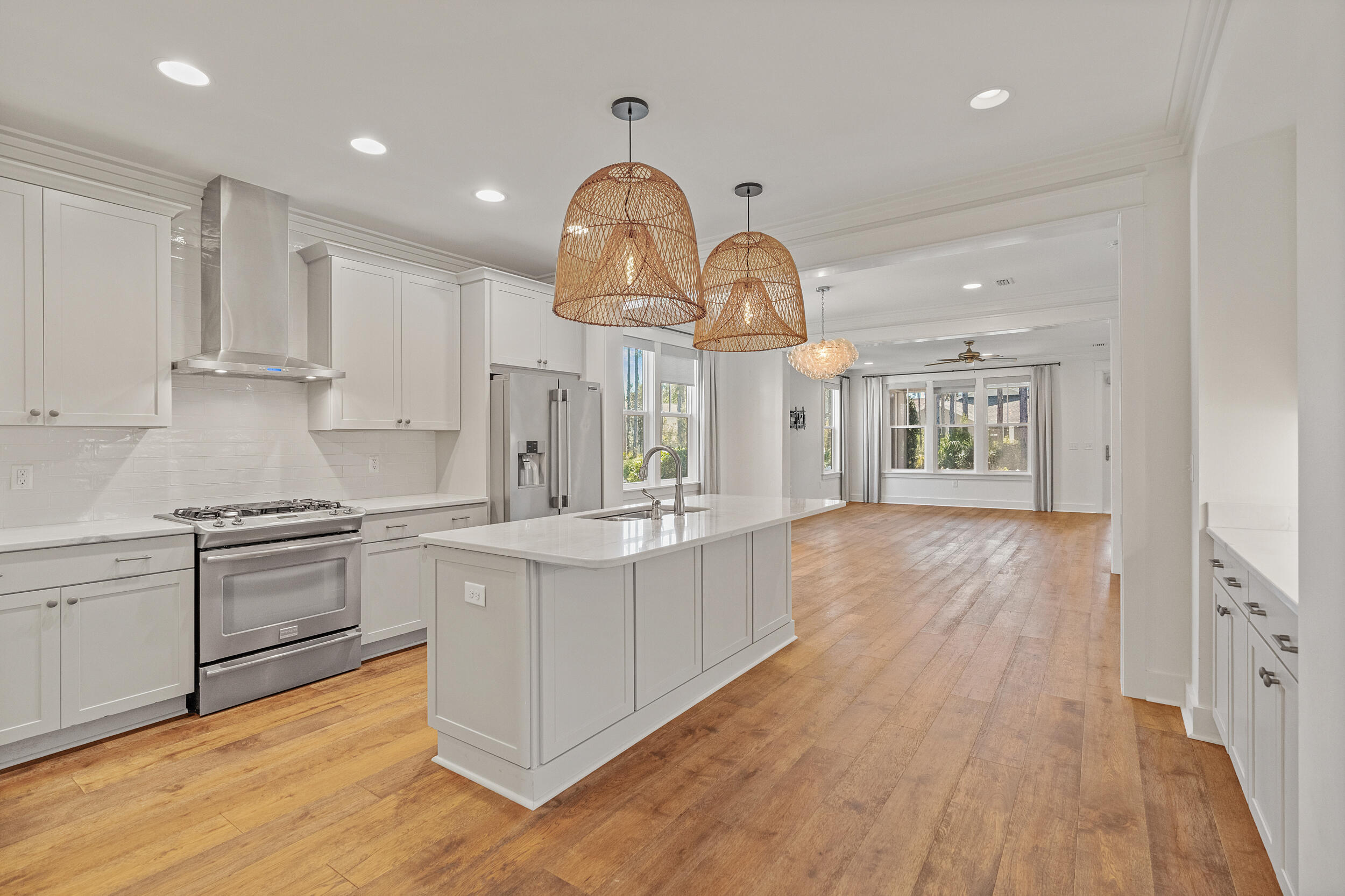 77 Cannonball Lane, Unit LOT (174) Inlet Beach, FL 32461 - Photo 3 of 46 a large kitchen with stainless steel appliances granite countertop a lot of counter space and wooden floors
