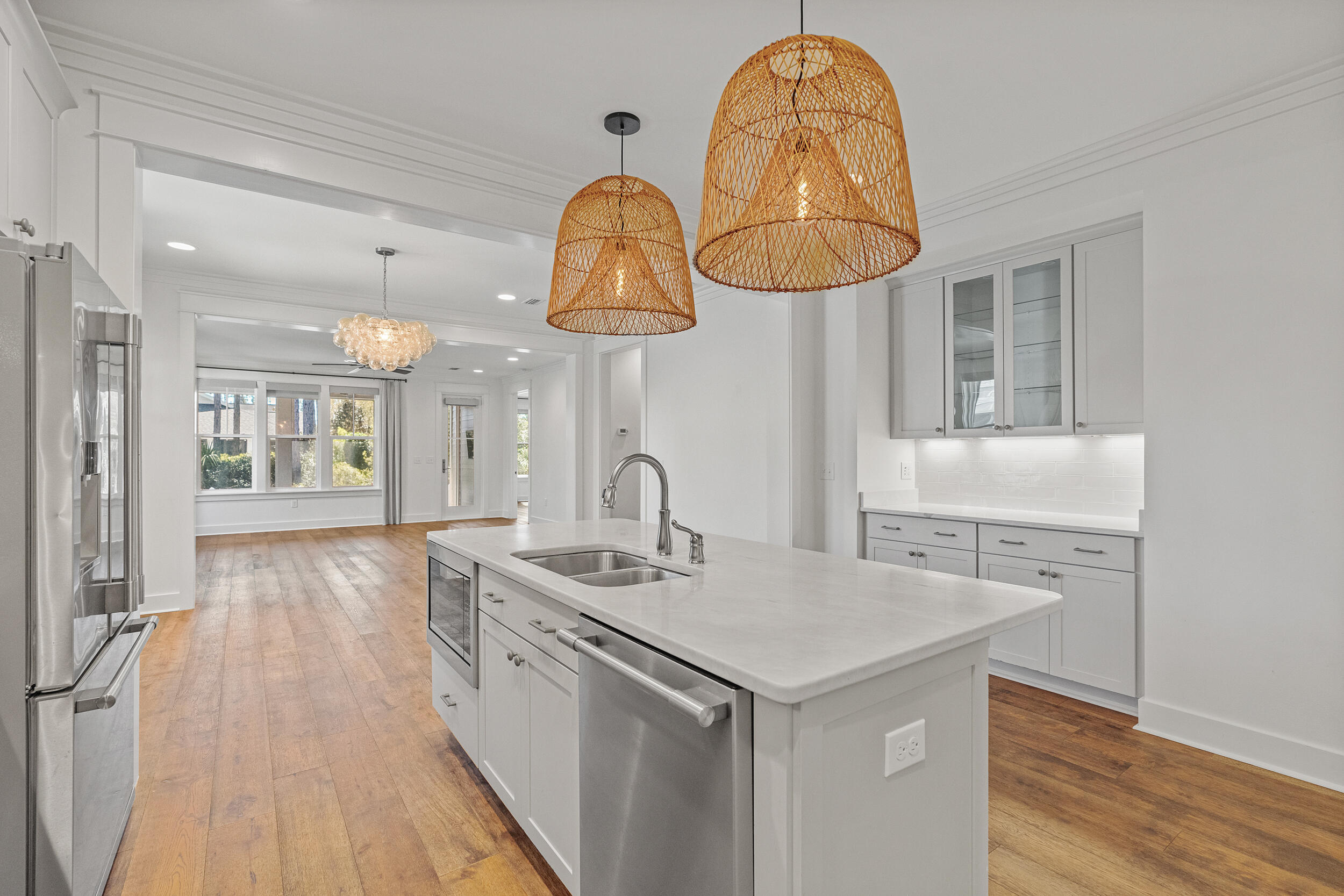 77 Cannonball Lane, Unit LOT (174) Inlet Beach, FL 32461 - Photo 8 of 46 a kitchen with a sink and a chandelier
