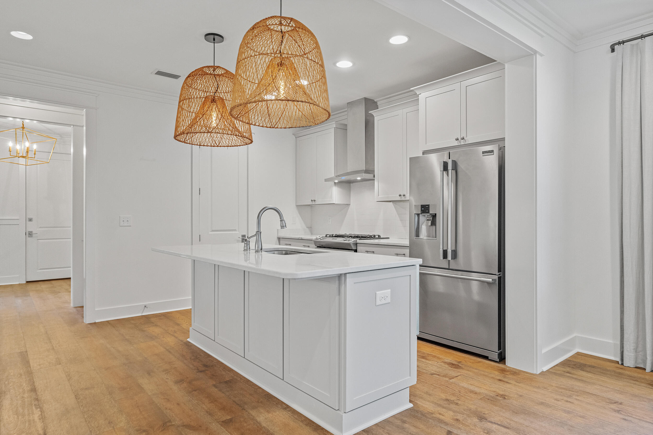 77 Cannonball Lane, Unit LOT (174) Inlet Beach, FL 32461 - Photo 10 of 46 a kitchen with stainless steel appliances granite countertop a sink a refrigerator and chandelier