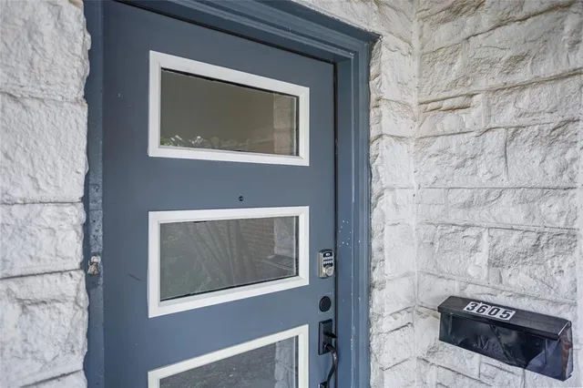 a stone house with a door