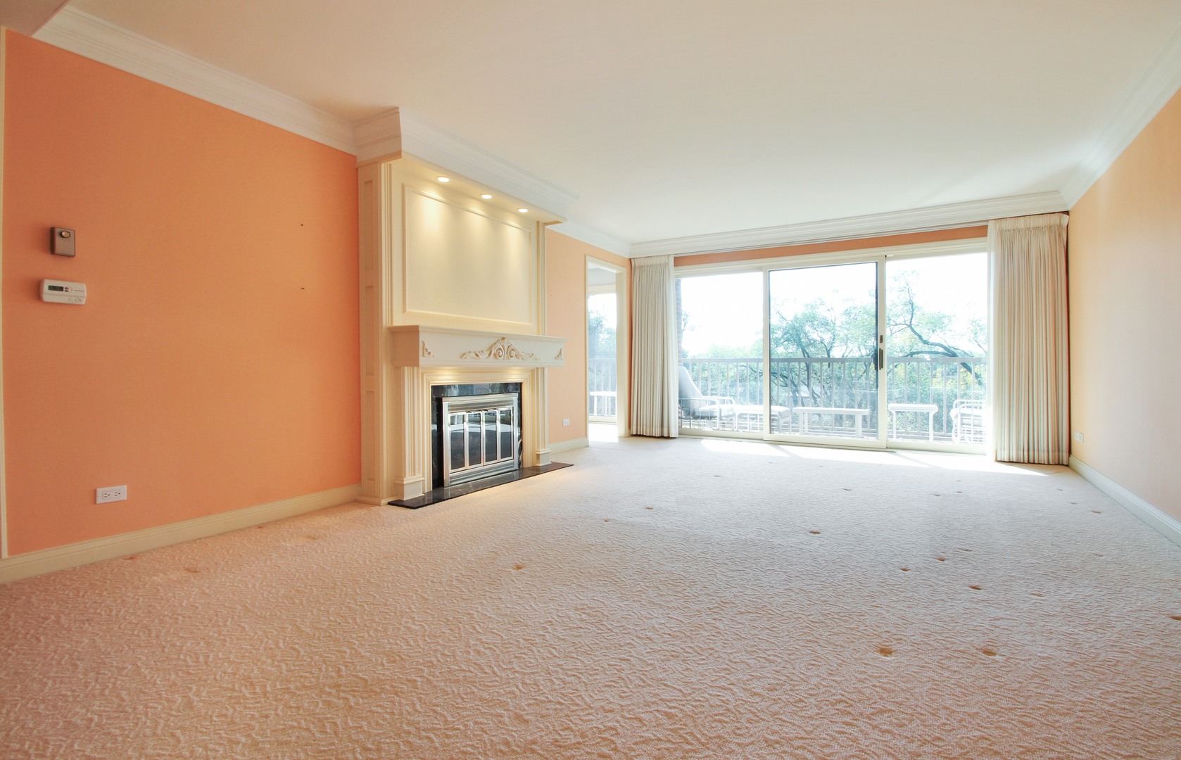 22 Park Lane, Unit 518 Park Ridge, IL 60068 - Photo 5 of 21 a view of an empty room with a fireplace and a window