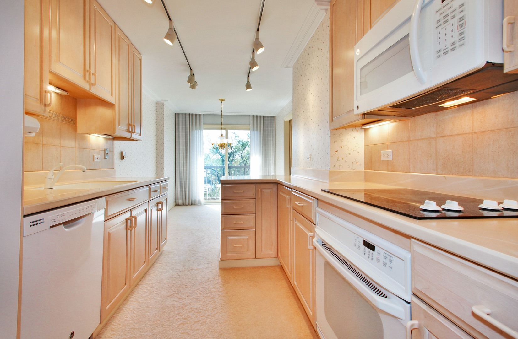 22 Park Lane, Unit 518 Park Ridge, IL 60068 - Photo 7 of 21 a kitchen with granite countertop a sink and cabinets