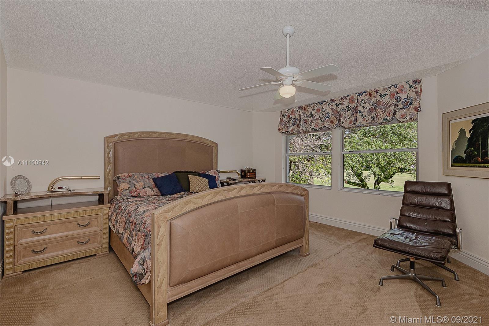2295 Northwest 53rd Street Boca Raton, FL 33496 - Photo 12 of 25 a bed room with a bed and a window