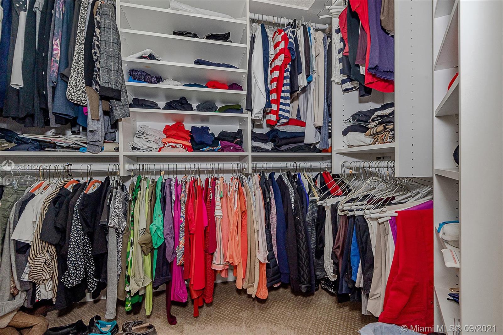 2295 Northwest 53rd Street Boca Raton, FL 33496 - Photo 15 of 25 a view of walk in closet with clothes