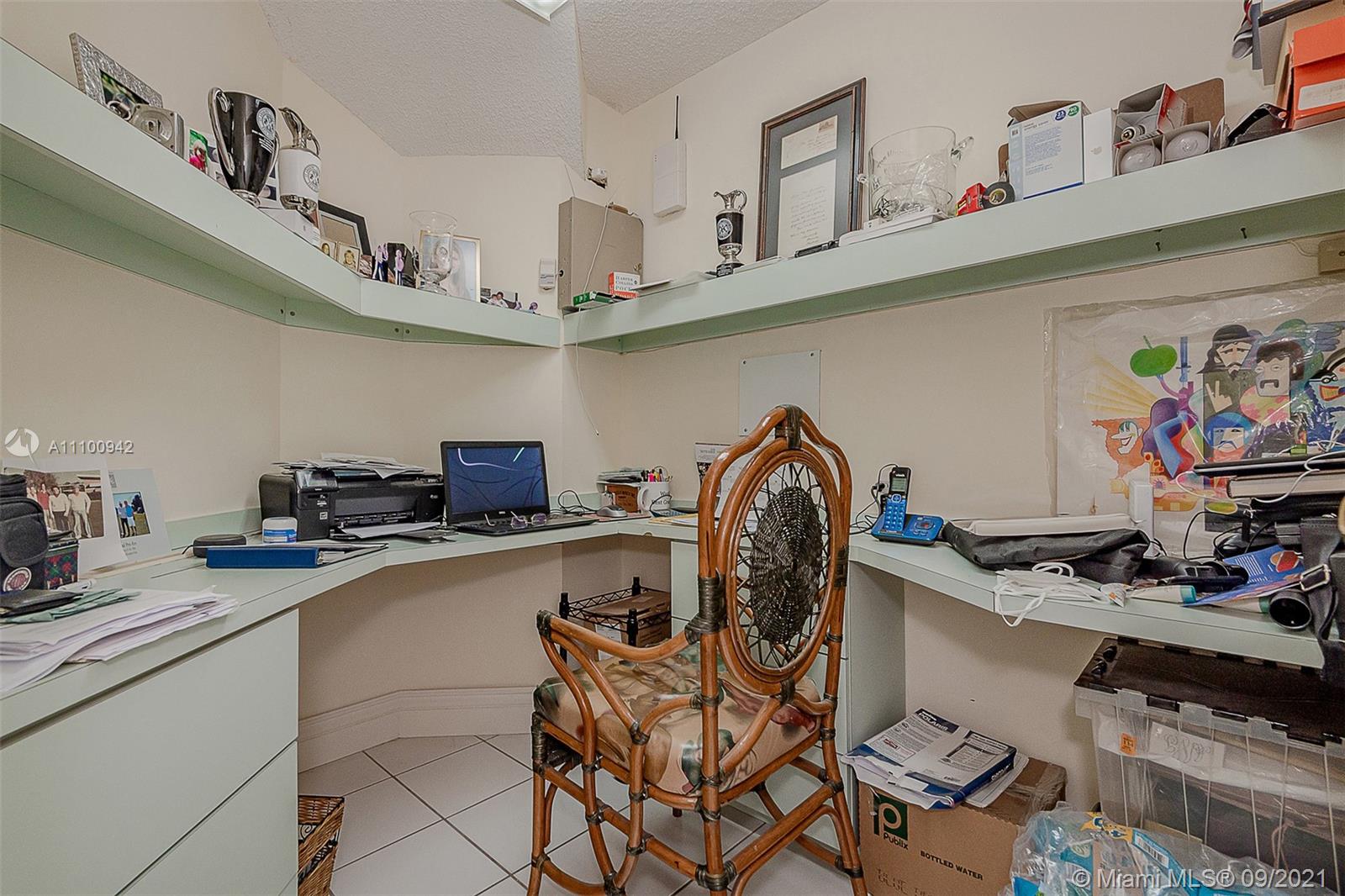 2295 Northwest 53rd Street Boca Raton, FL 33496 - Photo 18 of 25 a kitchen with stainless steel appliances granite countertop a sink and cabinets