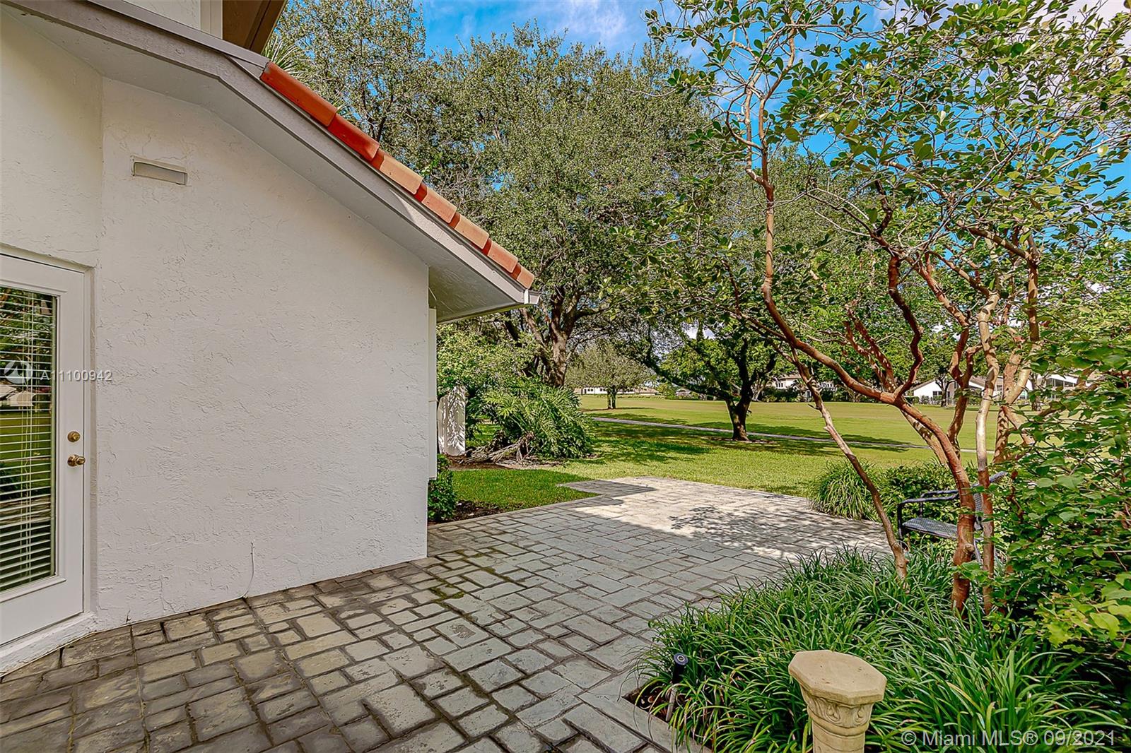 2295 Northwest 53rd Street Boca Raton, FL 33496 - Photo 22 of 25 a backyard of a house with lots of green space