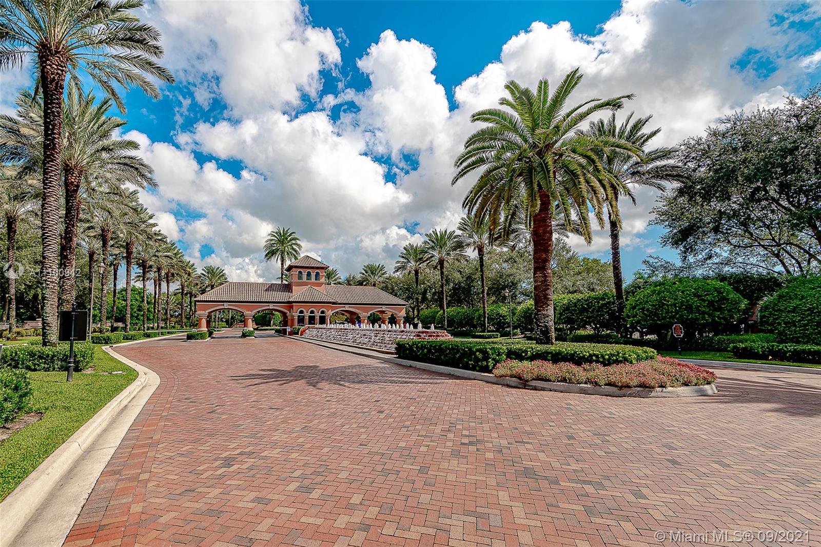 2295 Northwest 53rd Street Boca Raton, FL 33496 - Photo 25 of 25 a view of swimming pool with table and chairs and palm trees