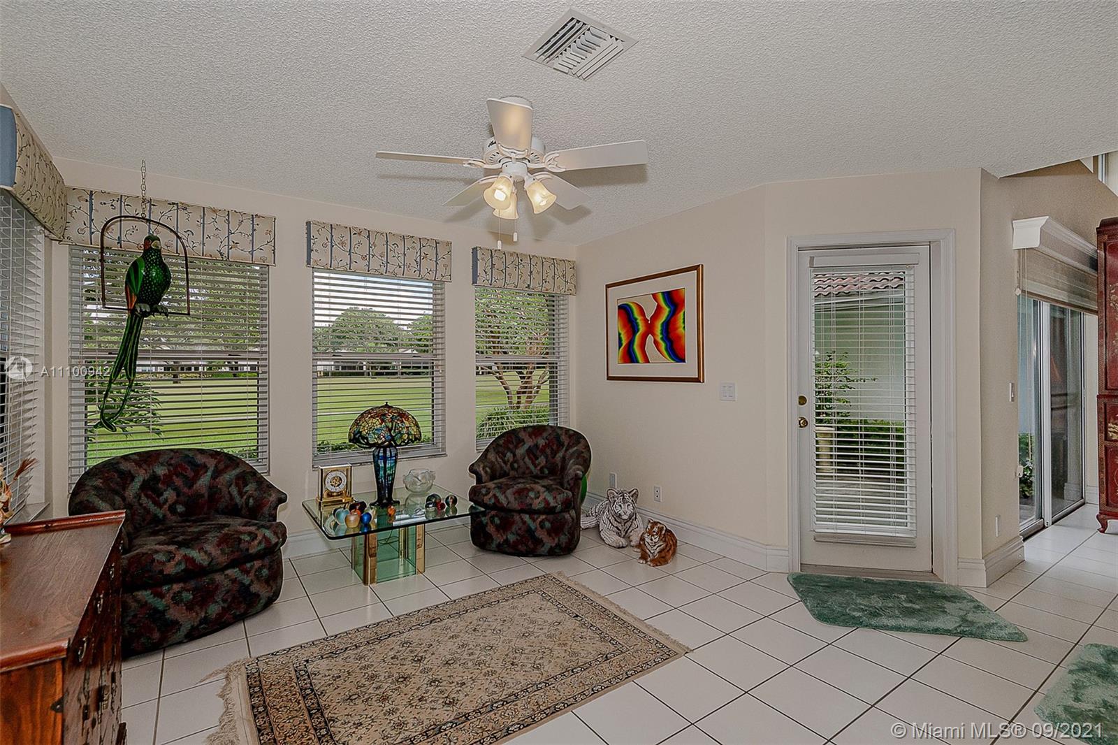 2295 Northwest 53rd Street Boca Raton, FL 33496 - Photo 4 of 25 a living room with furniture and a window