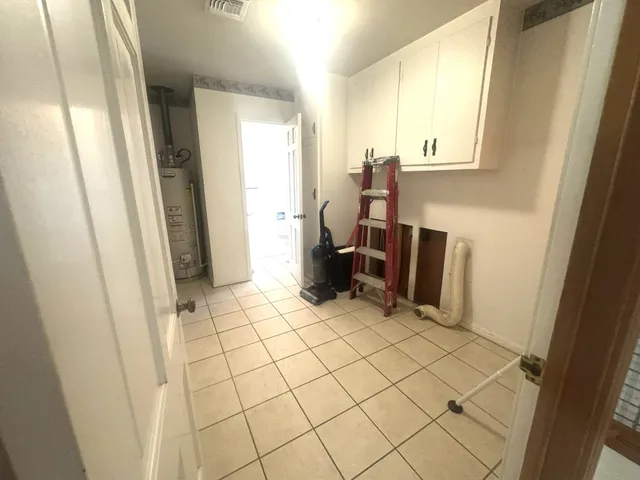 a bathroom with a sink mirror vanity and toilet