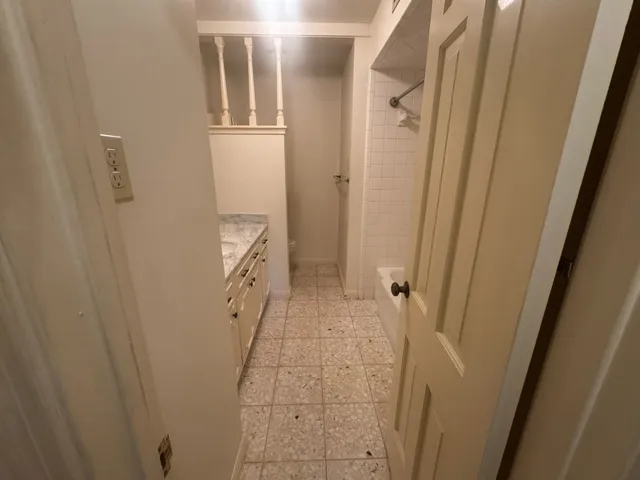 a bathroom with a granite countertop sink a mirror and a