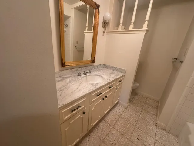 a bathroom with a shower and a bath tub