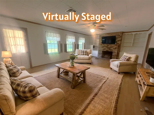 a living room with furniture and a fireplace