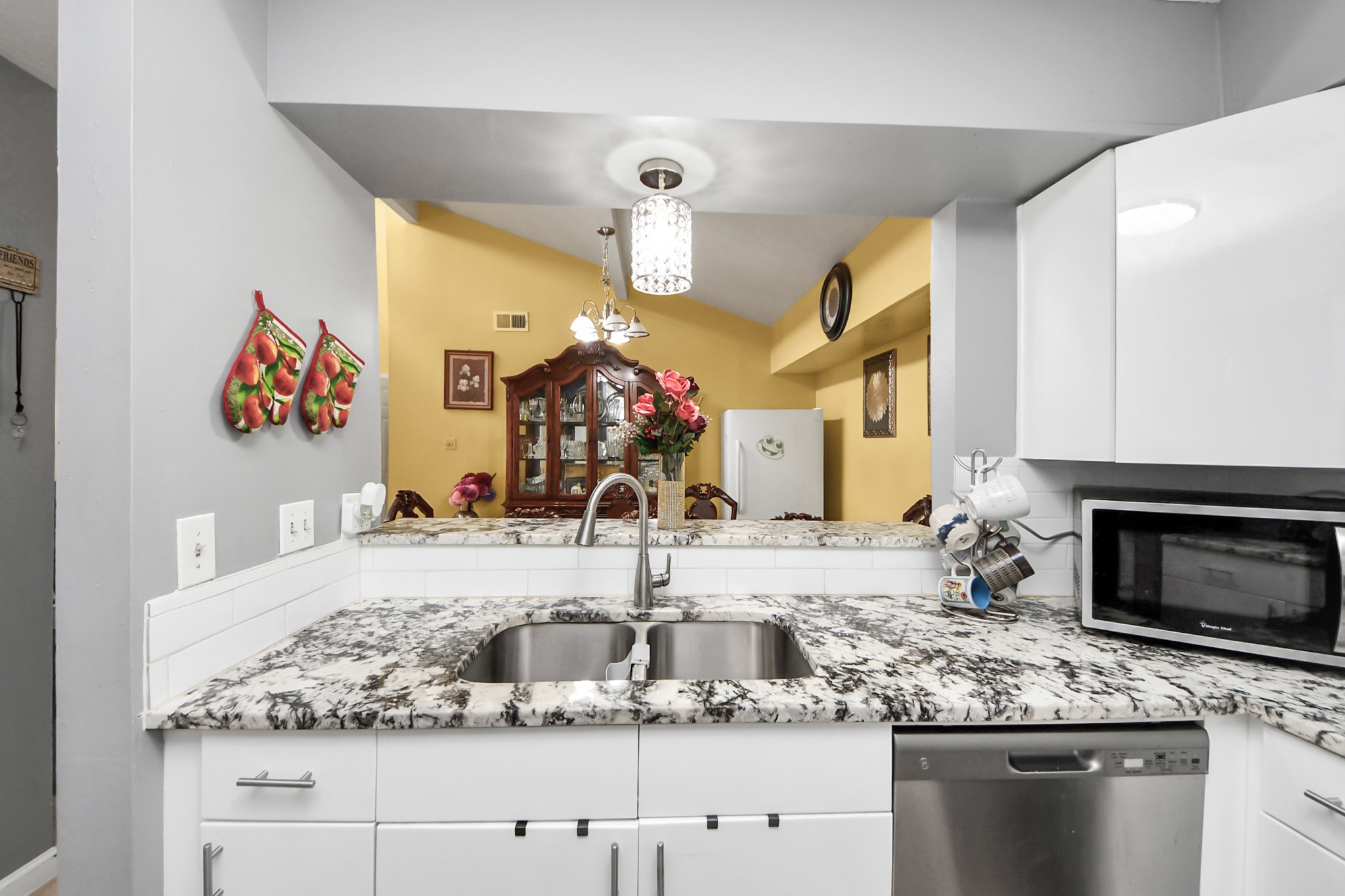 4155 Amir Street Houston, TX 77072 - Photo 20 of 43 a bathroom with a granite countertop sink and a mirror