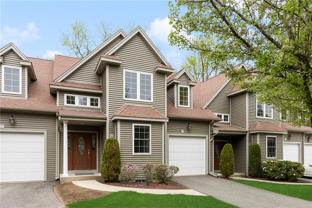 Exterior front with private entrance and garage.