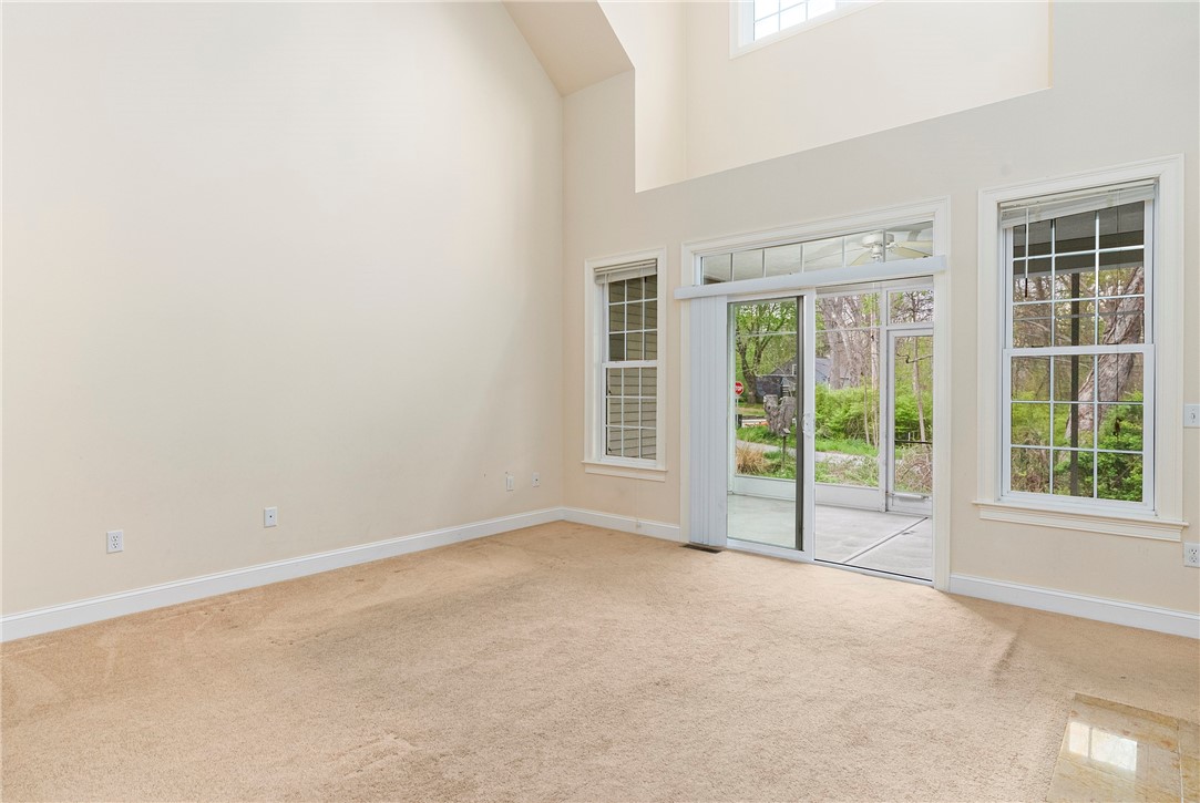 315 Old River Road, Unit 11 Lincoln, RI 02838 - Photo 6 of 27 Living area with gas fireplace and sliders to screen porch