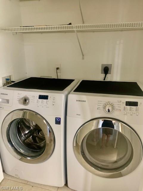 1180 Reserve Way, Unit 206 Naples, FL 34105 - Photo 10 of 22 a utility room with dryer and washer