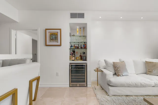 a living room with furniture and closet