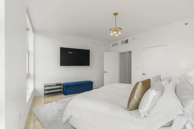 a view of a storage and utility room with washer and dryer