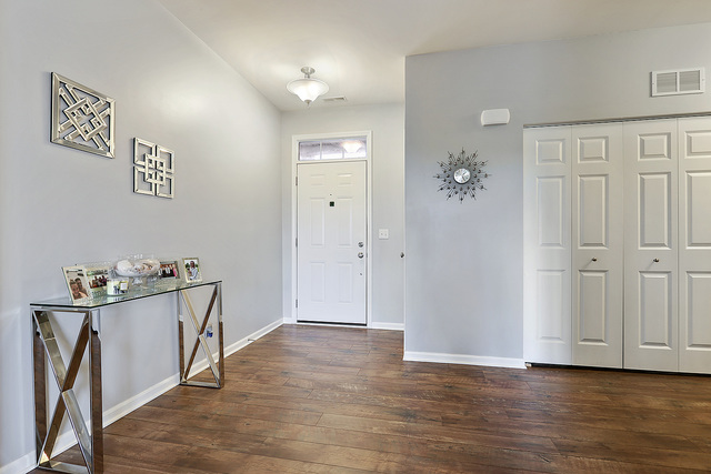 2816 Church Road Aurora, IL 60502 - Photo 4 of 20 an empty room with wooden floor