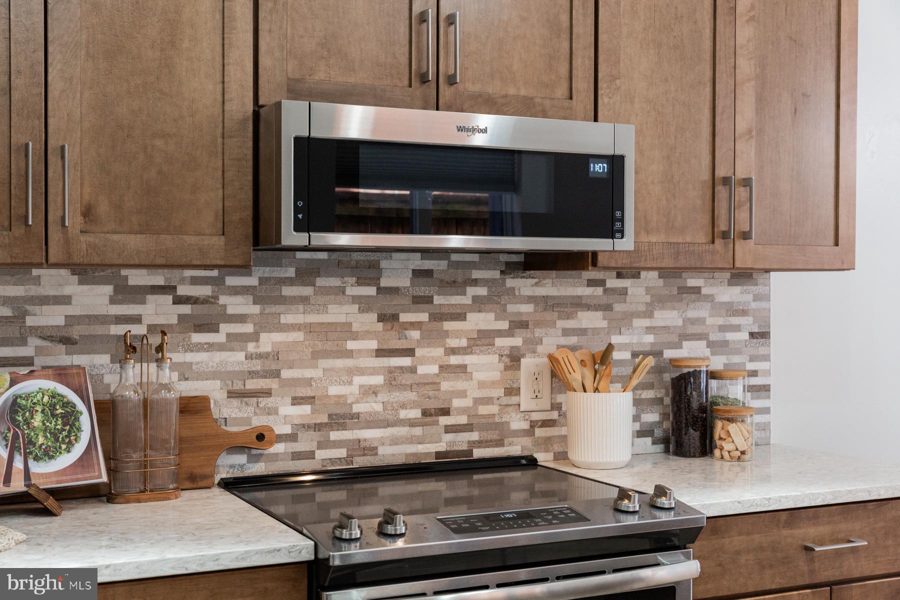 137 South Duke Street Lancaster, PA 17602 - Photo 13 of 51 a kitchen with a stove and a microwave