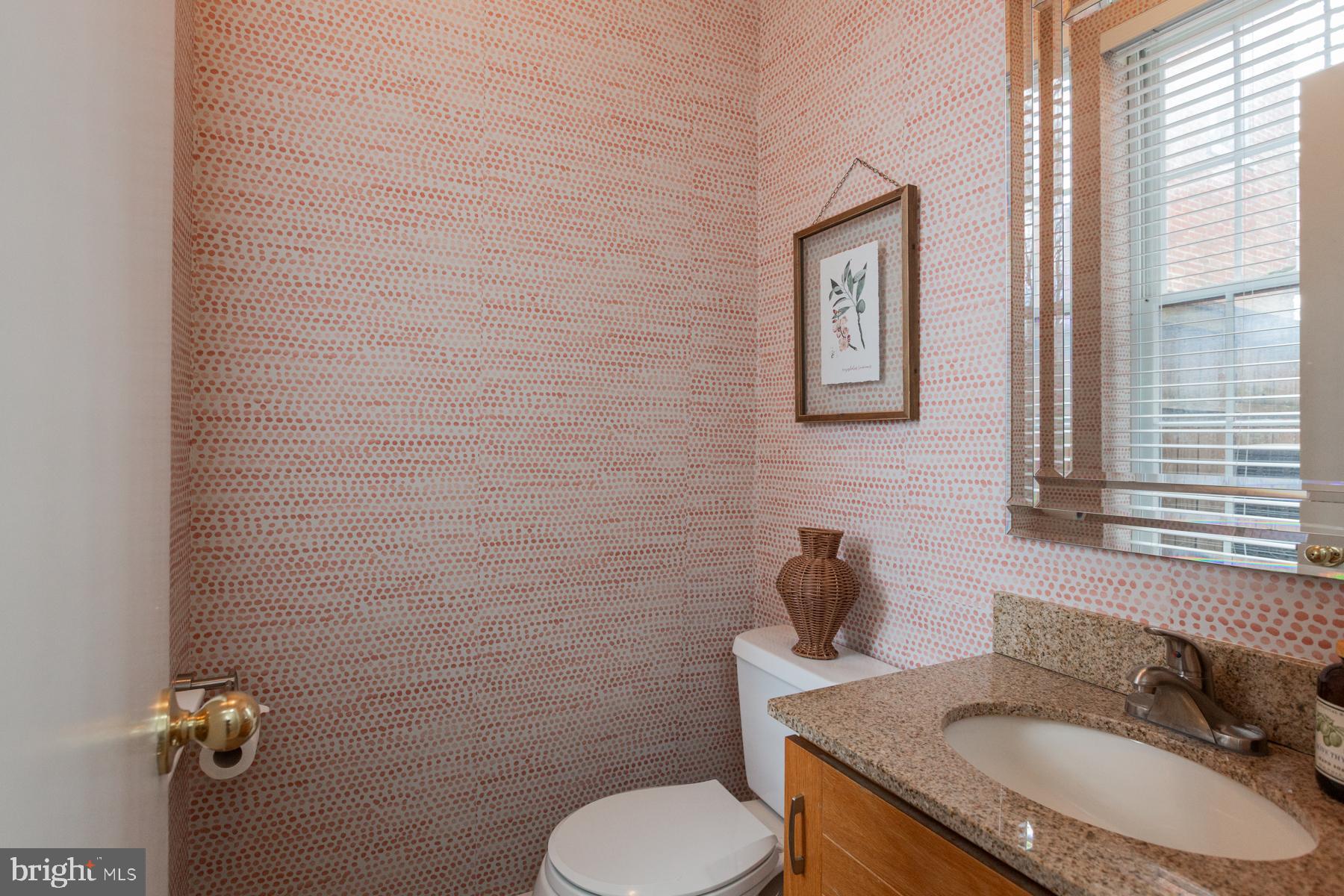 137 South Duke Street Lancaster, PA 17602 - Photo 21 of 51 a bathroom with a granite countertop toilet sink and mirror